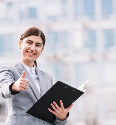 modern-businesswoman-with-clipboard-outdoors_23-2148002240